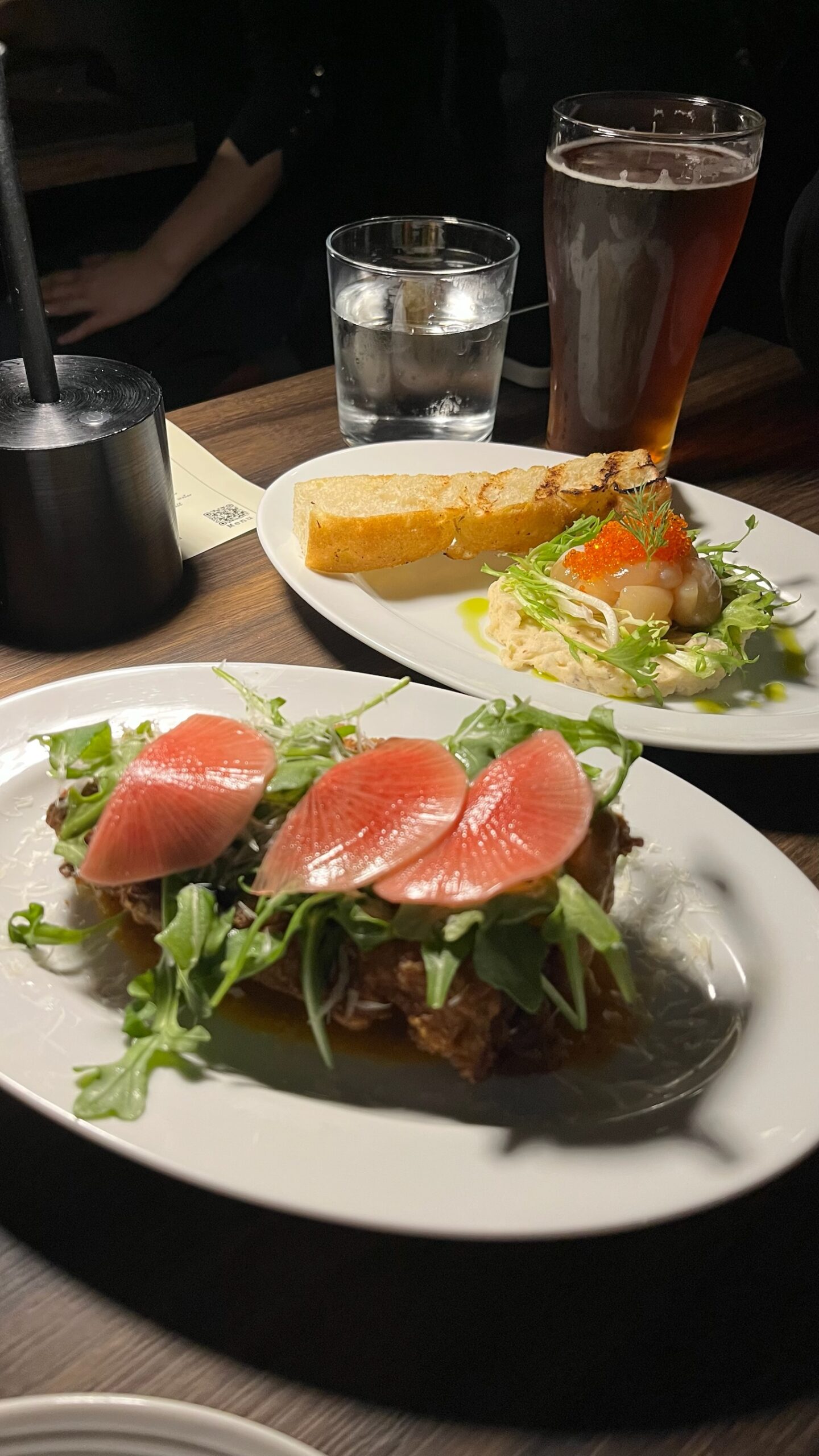 Smoked scallops with truffle egg salad, salmon roe, fennel fronds, and grilled focaccia