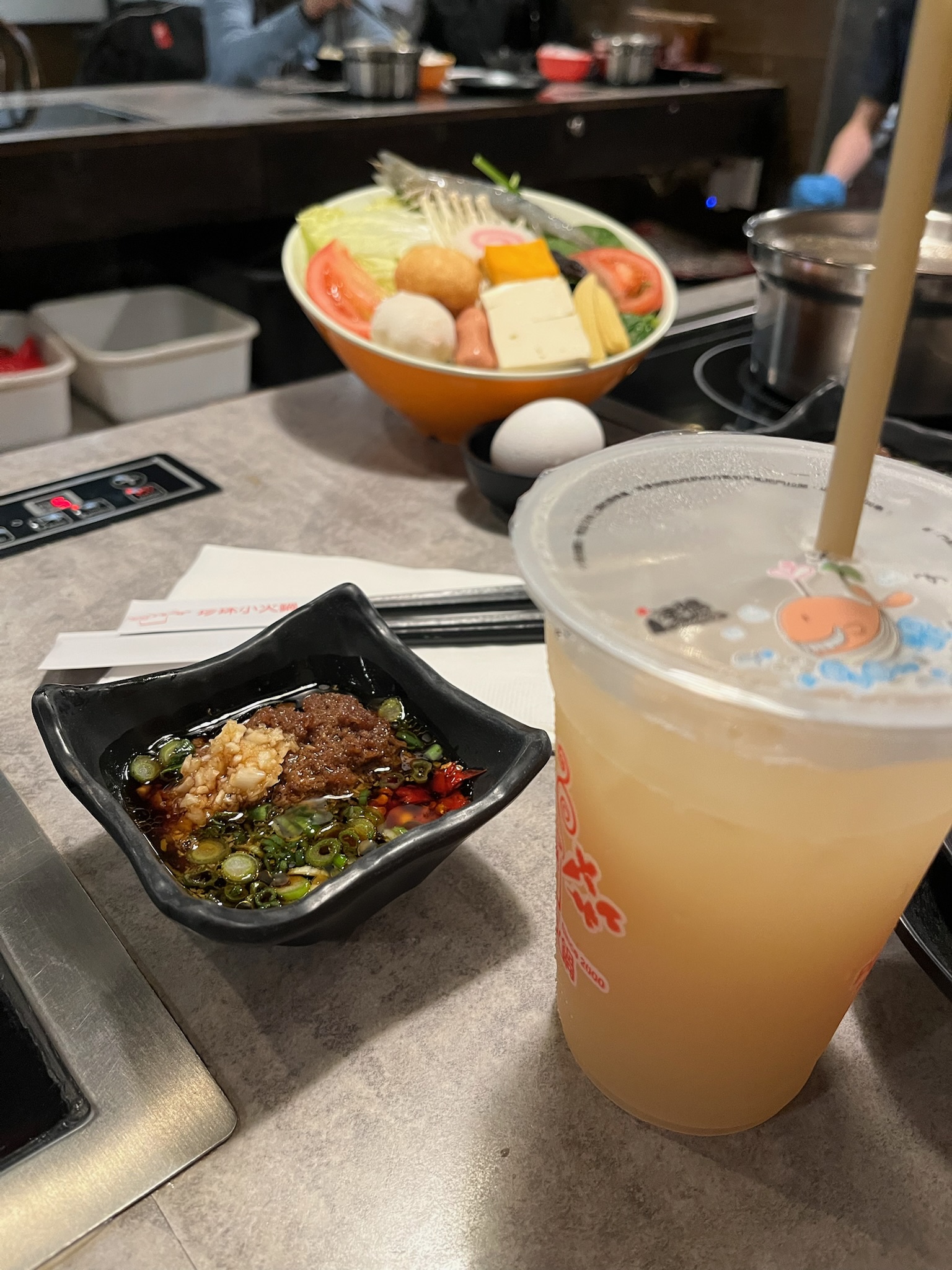 House dipping sauce and the included drink, with the veggie bowl visible in the background