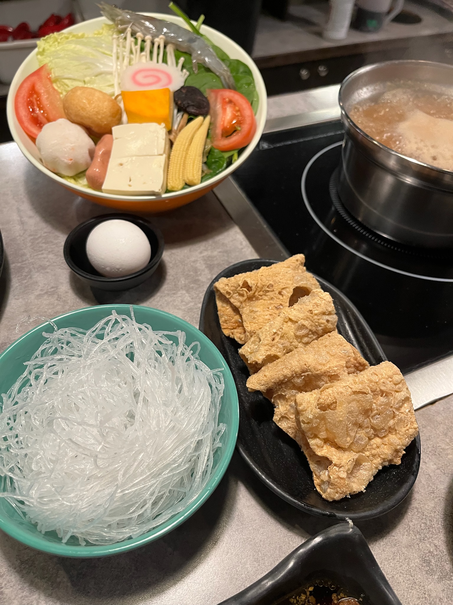 Glass noodles and fried tofu skin, ready to go into the pot