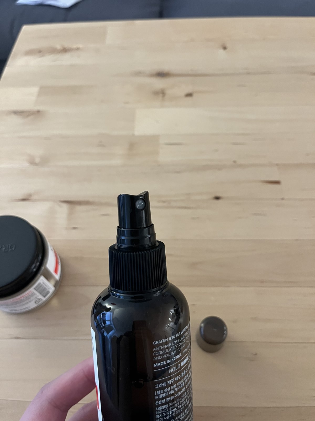 The pump-action fine-mist nozzle, more even than a compressed aerosol head